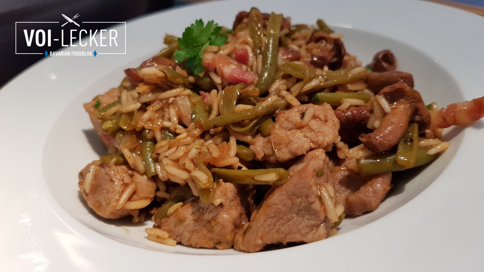 Reisfleisch mit Pfifferlingen, Bohnen und Speck